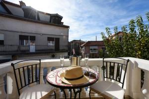 a hat sitting on a table on a balcony at Villa Danica ZadarVillas in Sukošan +30 photos