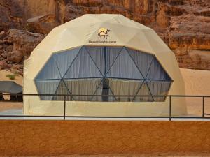 a tent with a camel on it in the desert at Desert Knights camp in Wadi Rum