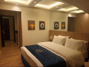 a bedroom with a large bed in a room at Batroun boutique suites in Batroûn