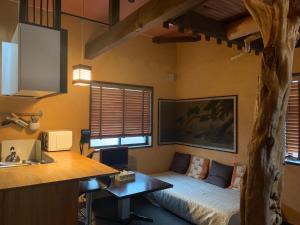 a room with a bed and a desk in it at SAKARA KYOTO 桜香楽 京都 in Kyoto