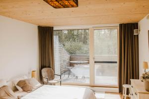 Een bed of bedden in een kamer bij ScraB&Ble Ecologische gastenkamers