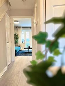 a living room with a view of a living room with a view of the ocean at Damson Drive- Boutique Home in Oldbury