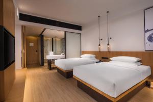 Postel nebo postele na pokoji v ubytování Fairfield by Marriott Jingdezhen