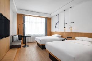 Postel nebo postele na pokoji v ubytování Fairfield by Marriott Jingzhou + 12 fotografií