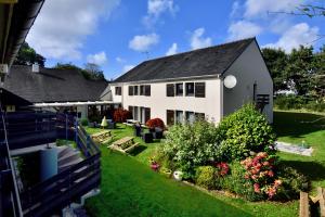 an aerial view of a white house with a yard at Kyriad Lannion-Perros-Guirec in Lannion