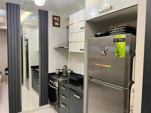 a kitchen with a stainless steel refrigerator in it at The Golden Horn Deluxe Vip Suite Beyoglu Istanbul in Istanbul
