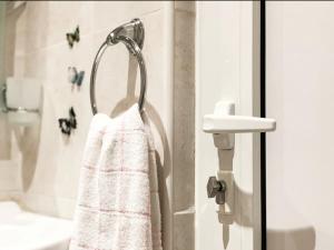 a bathroom with a towel hanging on a door at Amazing 2 bedrooms Modern Apartment in Stara Zagora in Stara Zagora