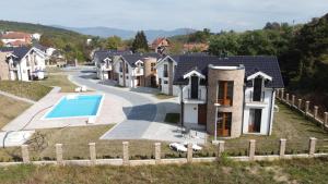 an aerial view of a house with a swimming pool at Crown TiM Villa in Vrnjačka Banja