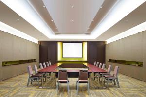 a conference room with a large table and chairs at Four Points By Sheraton Guilin Lingui in Guilin