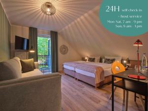 Postel nebo postele na pokoji v ubytování Classik Hotel Martinshof, Messe München