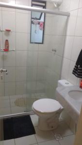 a bathroom with a shower and a toilet and a sink at LAZER NA ATALAIA in Aracaju +12 photos