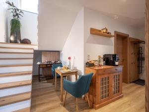 a kitchen and dining room with a table and chairs at Haus SaRo in Hopfgarten im Brixental