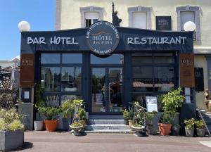 a restaurant with a sign that reads bar hotel and restaurant at Hôtel des Pins in Jullouville-les-Pins +9 photos