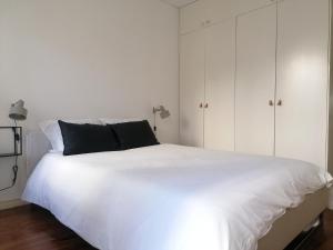 Casa com Jardim privado tesisinde bir odada yatak veya yataklar