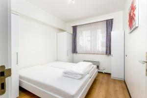 A bed or beds in a room at Appartement 0401, VILLA COGELS MIDDELKERKE