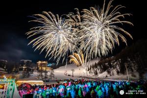 a crowd of people standing in front of a fireworks display at Charming Chalet w/ Mountain & Slope Views, Jacuzzi in Vars