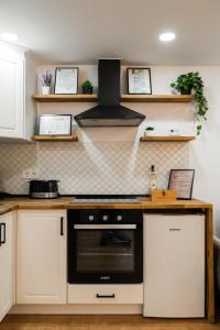 a kitchen with a counter with a stove top oven at Rope Street eState Picturesque in Braşov