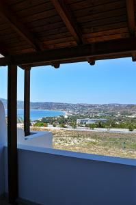 a view of the ocean from the balcony of a house at Panorama Studios in Kefalos