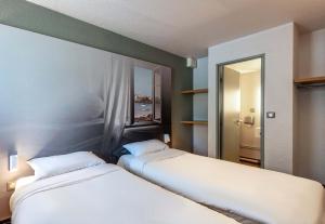 Postel nebo postele na pokoji v ubytování B&B HOTEL Morlaix