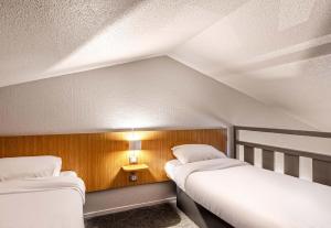 Postel nebo postele na pokoji v ubytování B&B HOTEL Morlaix