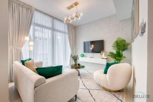 a living room with a couch and two chairs at Restful 3BR Townhouse at DAMAC Hills 2 Dubailand by Deluxe Holiday Homes in Dubai