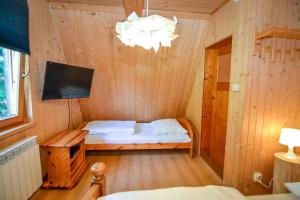 Postel nebo postele na pokoji v ubytování Wspólna Chata
