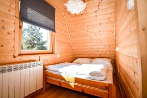 Postel nebo postele na pokoji v ubytování Wspólna Chata