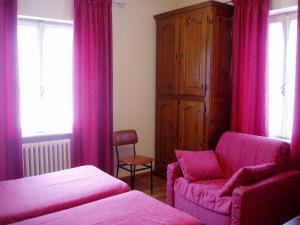 Rúm í herbergi á Albergo Delle Alpi