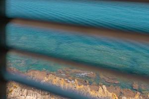 an aerial view of the ocean and the coast at Taliammari in Cefalù