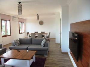 a living room with a couch and a table at The Townhouse Apartment in Kas