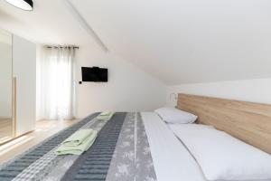 Posteľ alebo postele v izbe v ubytovaní Family apartments Zadar - Ryanair's September
