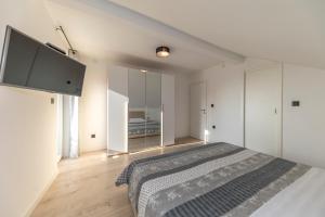 Posteľ alebo postele v izbe v ubytovaní Family apartments Zadar - Ryanair's September