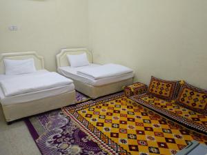 Postel nebo postele na pokoji v ubytování Hotel Ain Safnan Room&Flats فندق عين صفنان غرف&شقق