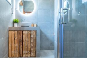 a bathroom with a sink and a shower at Ticket2Surf in Palheiros da Tocha +54 photos