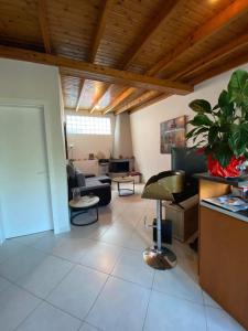 a living room with a couch and a table at Oasi in Salamina +1 photo
