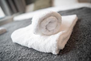 a white towel sitting on top of a counter at 123 Queen Street - Home Crowd Luxury Apartments in Sheffield