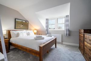 a bedroom with a large bed and a window at Dewsbury Court in York