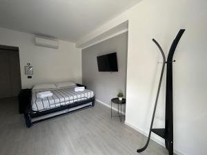 Ein Bett oder Betten in einem Zimmer der Unterkunft Corridoni33 - Immobili e Soluzioni Rent