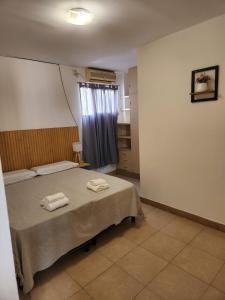 A bed or beds in a room at Petit Balcarce Salta