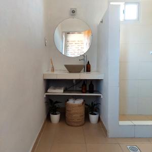 a bathroom with a sink and a mirror at Salir del Cráter Apart in Chilecito +14 photos
