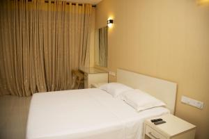 Postel nebo postele na pokoji v ubytování Nilawin Hotels & Resorts
