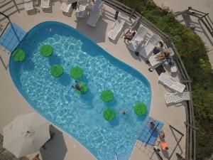 an overhead view of a swimming pool with people in it at Smugglers' Notch Resort Private Suites in Cambridge