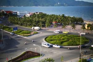 a city with a lot of cars in a parking lot at Tuyet Son Hotel (TS Ocean Hotel) in Da Nang