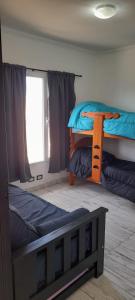Dviaukštė lova arba lovos apgyvendinimo įstaigoje Maktub Alojamiento