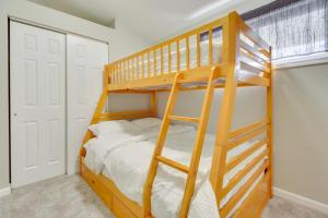 a bedroom with a bunk bed with a ladder at Pet-Friendly Ohio Escape with Patio, Near Downtown! in Dayton