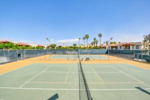 a tennis court with a net on a tennis court at Resort Perks, Private Patio Palm Springs Condo! in Palm Springs