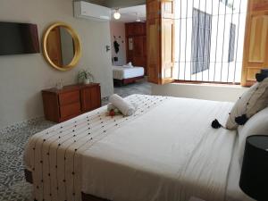Postel nebo postele na pokoji v ubytování Hotel Casa Piedad