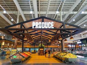 a produce section of a grocery store with a produce sign at Staycation @ UpperEast w/ Pool, Gym, Daycare etc.! in Bacolod