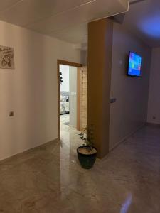 TV a/nebo společenská místnost v ubytování appartement à oujda