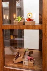 a glass window with a bunch of objects in boxes at Casa Alhaja by Shiadu in Seville